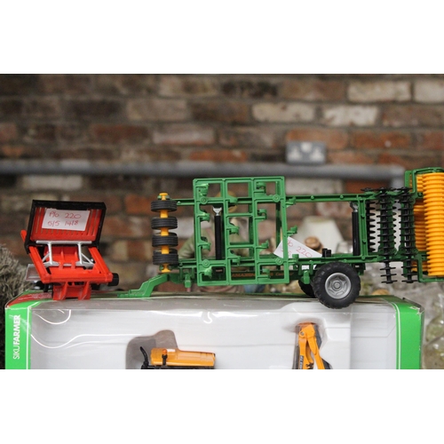 220 - FOUR SIKU 1:32 SCALE FARM MODELS TO INCLUDE A VALTRA TRACTOR WITH KUHN EMBANKMENT MOWER (AS NEW IN B... 