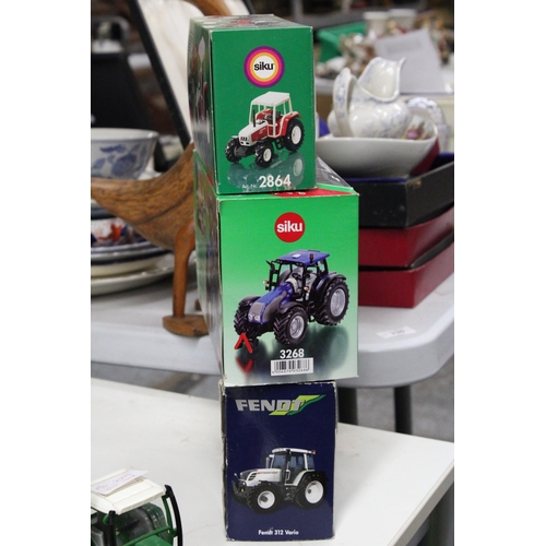 222 - THREE SIKU 1:32 SCALE TRACTOR MODELS TO INCLUDE A LIMITED EDITION FENDT 312 VARIO, A VALTRA T191 AND... 