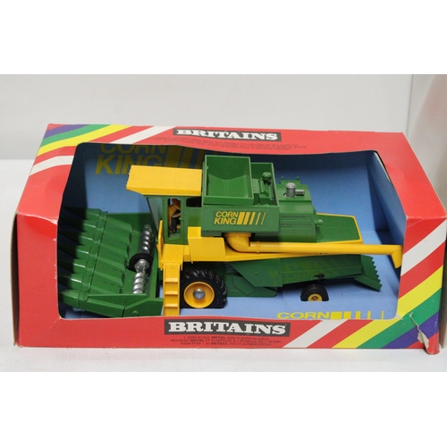 506 - TWO BRITAINS 1:32 SCALE MODELS TO INCLUDE A COMBINE HARVESTER WITH MAIZE HEAD - AS NEW IN BOX AND A ... 