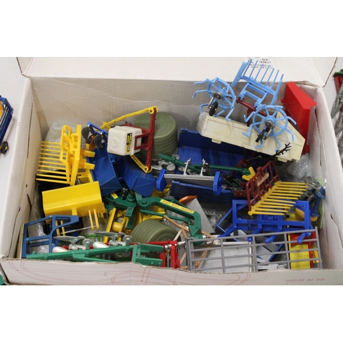 517 - A QUANTITY OF BRITAINS FARMYARD ACCESSORIES TO INCLUDE TRAILERS, A CONVEYOR BELT, HARROWS, PLOUGHS, ... 