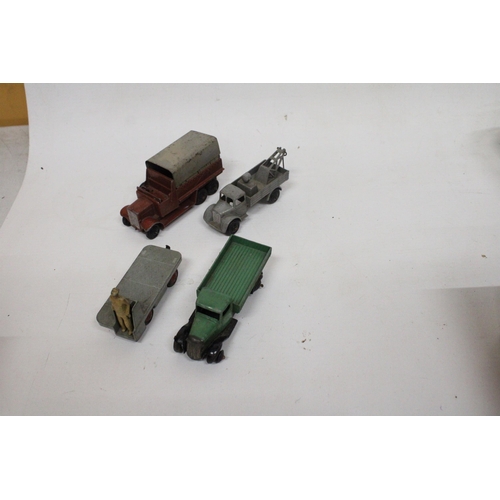 592 - FOUR VINTAGE DINKY MODELS TO INCLUDE A BREAKDOWN TRUCK IN GREY, A LOW SIDED OPEN TRUCK, A SIX WHEELE... 