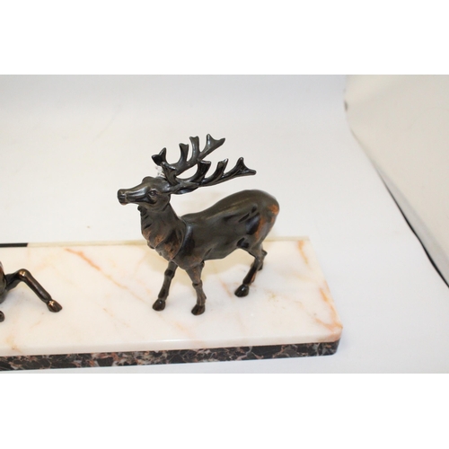 69 - AN ART DECO PAIR OF STAGS ON A MARBLE BASE