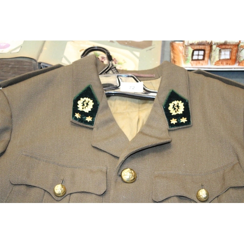 72 - A MEN'S MILITARY TUNIC WITH BRASS MEDALS