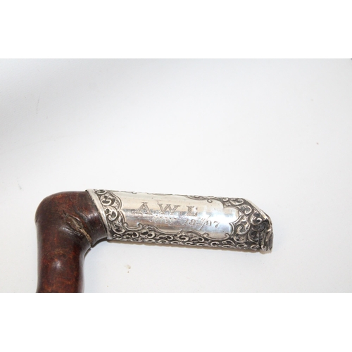 75 - A WALKING STICK WITH A HALLMARKED SILVER FINIAL