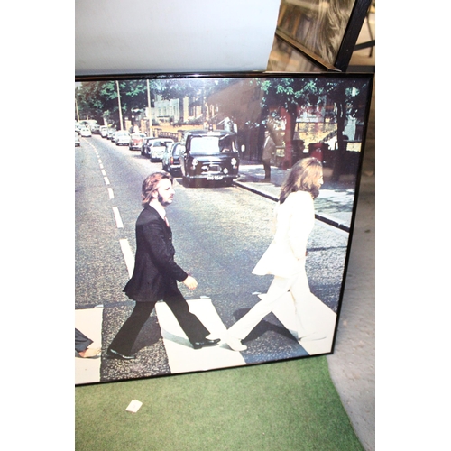 83 - A FRAMED POSTER OF THE BEATLES ABBEY ROAD - 84 X 51 CM