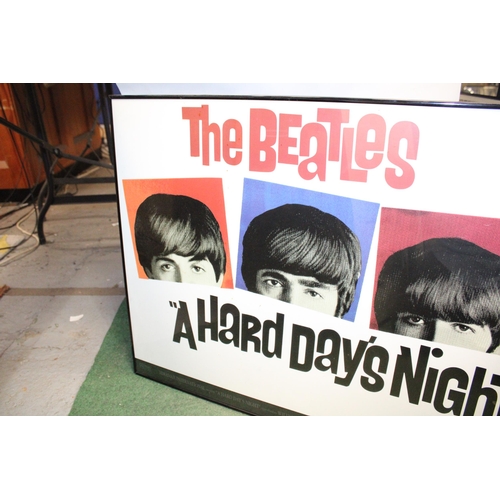 87 - A FRAMED POSTER OF THE BEATLES 