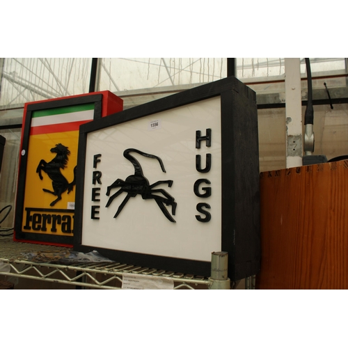 AN ILLUMINATED 'FREE HUGS' SIGN