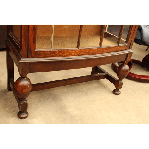 2882 - AN EARLY 20TH CENTURY OAK CHINA CUPBOARD ON OPEN BASE WITH BULBOUS FRONT LEGS 26.5