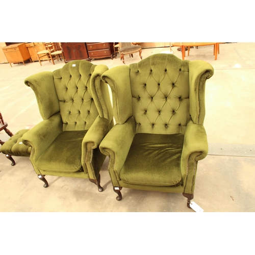 2889 - A PAIR OF GREEN BUTTON BACK WINGED FIRESIDE CHAIRS ON CABRIOLE LEGS AND STOOL