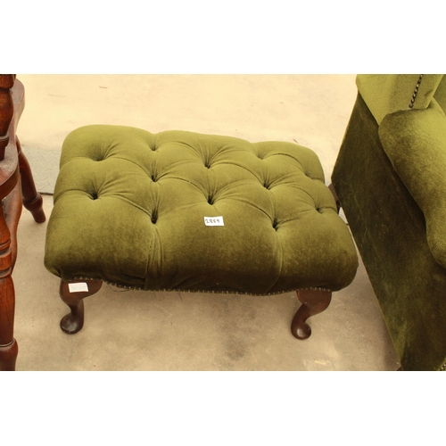 2889 - A PAIR OF GREEN BUTTON BACK WINGED FIRESIDE CHAIRS ON CABRIOLE LEGS AND STOOL