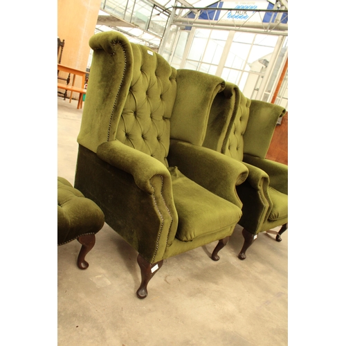 2889 - A PAIR OF GREEN BUTTON BACK WINGED FIRESIDE CHAIRS ON CABRIOLE LEGS AND STOOL