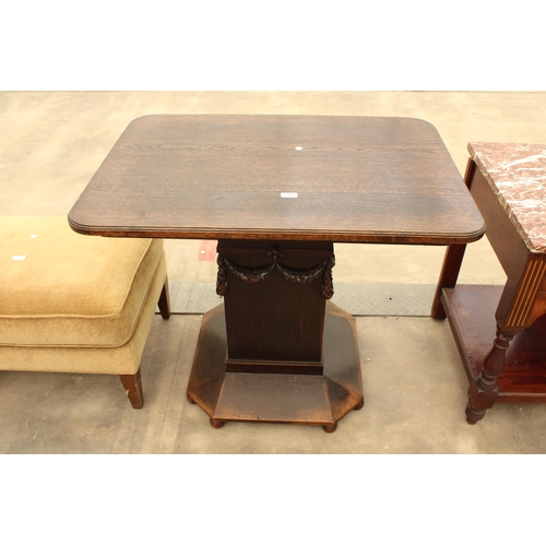 2898 - AN OAK ART DECO CENTRE TABLE DECORATED WITH SWAGS, 38 X 26