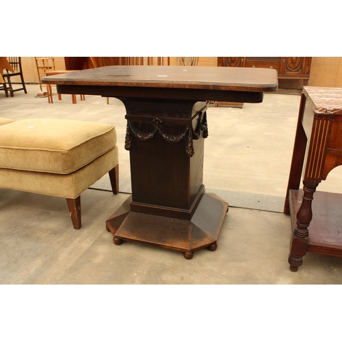 2898 - AN OAK ART DECO CENTRE TABLE DECORATED WITH SWAGS, 38 X 26