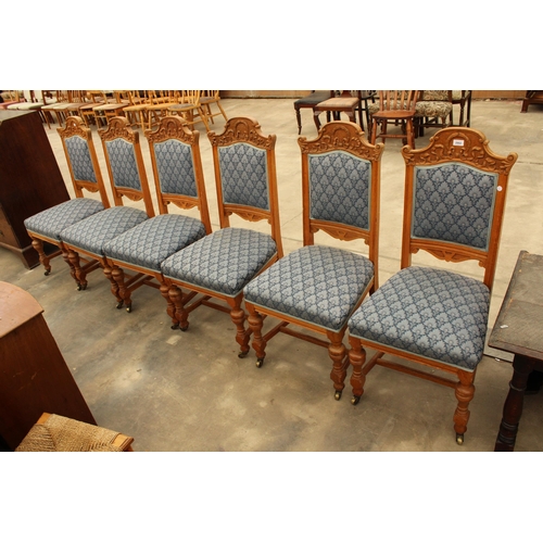 2902 - A SET OF SIX OAK LATE VICTORIAN DINING CHAIRS WITH CARVED TOP RAILS AND TURNED FRONT LEGS