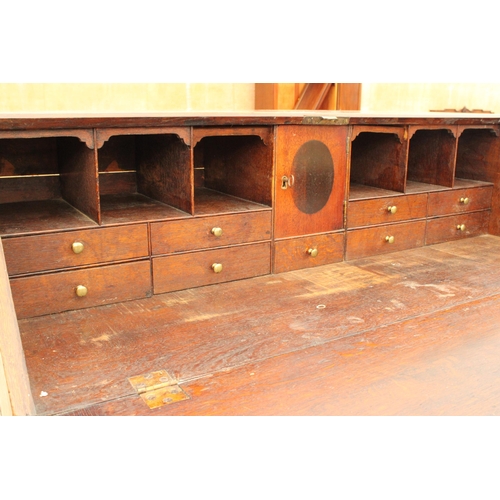 2903 - AN OAK GEORGE III BUREAU WITH FITTED INTERIOR, FOUR GRADUATED DRAWERS AND BRACKET FEET, 42.5