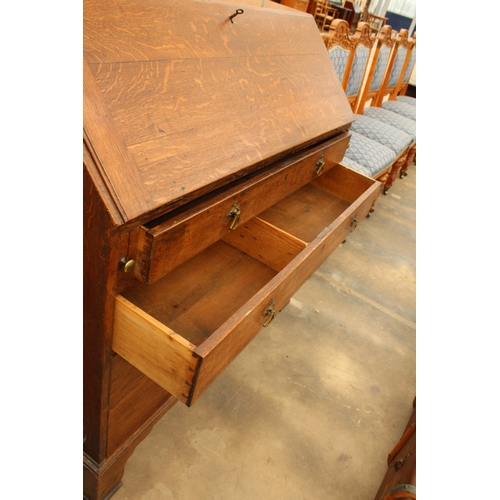 2903 - AN OAK GEORGE III BUREAU WITH FITTED INTERIOR, FOUR GRADUATED DRAWERS AND BRACKET FEET, 42.5