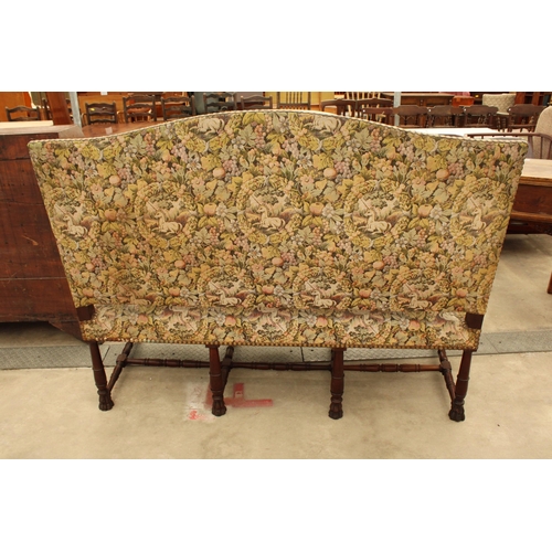 2904 - A CAROLEAN STYLE HEAVILY CARVED COUCH BY UNICORN UPHOLSTERY, 64