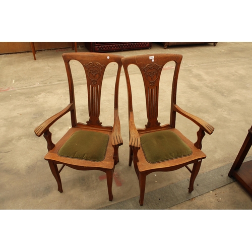 2911 - A PAIR OF CANADIAN OAK EARLY 20TH CENTURY ELBOW CHAIRS