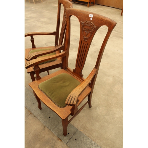 2911 - A PAIR OF CANADIAN OAK EARLY 20TH CENTURY ELBOW CHAIRS