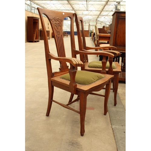 2911 - A PAIR OF CANADIAN OAK EARLY 20TH CENTURY ELBOW CHAIRS