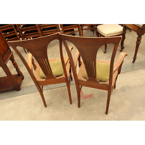 2911 - A PAIR OF CANADIAN OAK EARLY 20TH CENTURY ELBOW CHAIRS