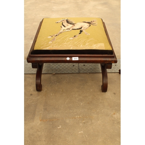 2915 - A VICTORIAN MAHOGANY STOOL ON X-FRAME LEGS AND WOOLWORK TOP DEPICTING A HORSE