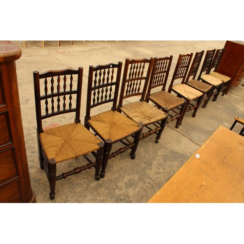 2918 - EIGHT GEORGE III HARLEQUIN LANCASHIRE SPINDLE BACK DINING CHAIRS WITH RUSH SEATS