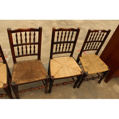 2918 - EIGHT GEORGE III HARLEQUIN LANCASHIRE SPINDLE BACK DINING CHAIRS WITH RUSH SEATS