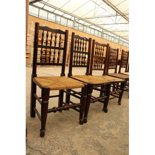 2918 - EIGHT GEORGE III HARLEQUIN LANCASHIRE SPINDLE BACK DINING CHAIRS WITH RUSH SEATS