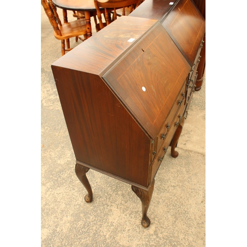 2923 - A MODERN MAHOGANY AND INLAID BUREAU ON CABRIOLE LEGS, 24