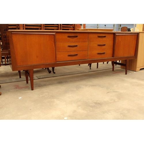 2937 - A ROYAL HERITAGE RETRO TEAK SIDEBOARD INCLUSIVE THREE DRAWERS AND THREE SLIDING DOORS, ONE BEING THR... 