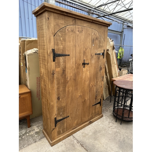 2948 - A HEAVY OAK CABINET WITH TWO DOORS AND SEVEN INNER SHELVES