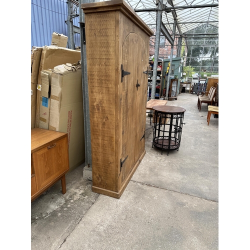 2948 - A HEAVY OAK CABINET WITH TWO DOORS AND SEVEN INNER SHELVES