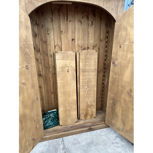 2948 - A HEAVY OAK CABINET WITH TWO DOORS AND SEVEN INNER SHELVES