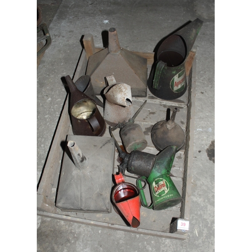 39 - SPRITTING BOX OF OIL CANS AND FUNNELS  + VAT