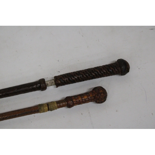 9 - TWO VINTAGE RIDING CROPS WITH DISPATCHER BLADES