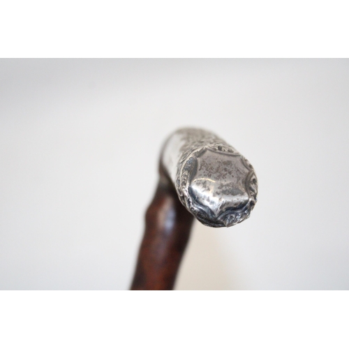 75 - A WALKING STICK WITH A HALLMARKED SILVER FINIAL