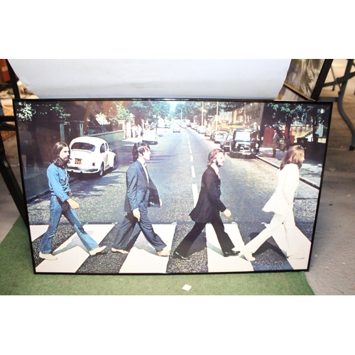 83 - A FRAMED POSTER OF THE BEATLES ABBEY ROAD - 84 X 51 CM