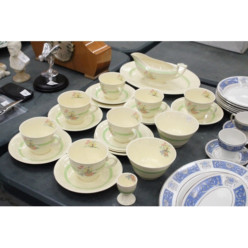 151 - A FLORAL TEA SET TO INCLUDE SEVEN CUPS AND SAUCERS, TWO SUGAR BOWLS, GRAVY JUG ETC