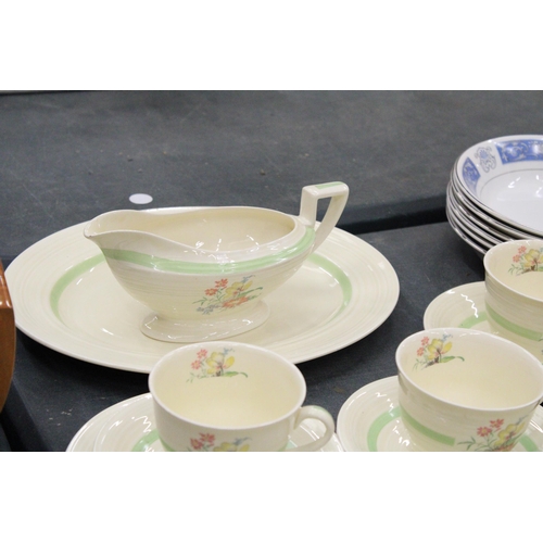 151 - A FLORAL TEA SET TO INCLUDE SEVEN CUPS AND SAUCERS, TWO SUGAR BOWLS, GRAVY JUG ETC