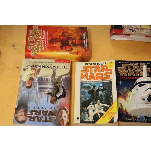 581 - SIX STAR WARS BOOKS AND TWO WALKIE TALKIES