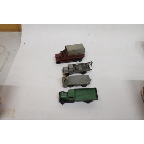 592 - FOUR VINTAGE DINKY MODELS TO INCLUDE A BREAKDOWN TRUCK IN GREY, A LOW SIDED OPEN TRUCK, A SIX WHEELE... 