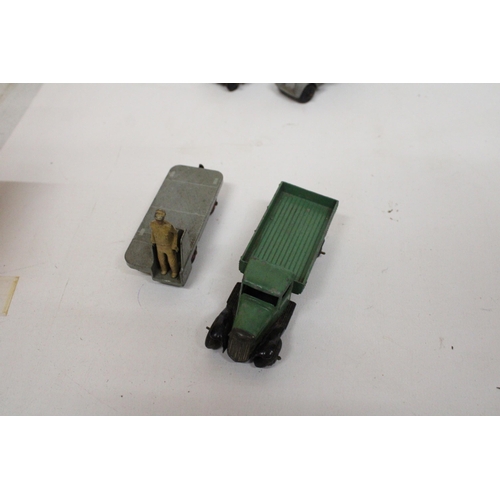 592 - FOUR VINTAGE DINKY MODELS TO INCLUDE A BREAKDOWN TRUCK IN GREY, A LOW SIDED OPEN TRUCK, A SIX WHEELE... 