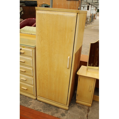 2729 - A MID 20TH CENTURY LIMED COMBINATION WARDROBE CHEST WITH DRESSING TABLE RETURN WITH TRIPLE MIRROR