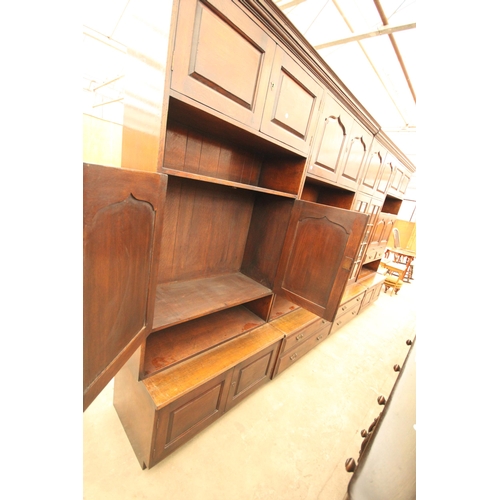 2779 - A RANGE OF FOUR OAK LOUNGE UNITS TO INCLUDE GLAZED BOOKCASE, BUREAU AND COCKTAIL SECTION ENCLOSING F... 