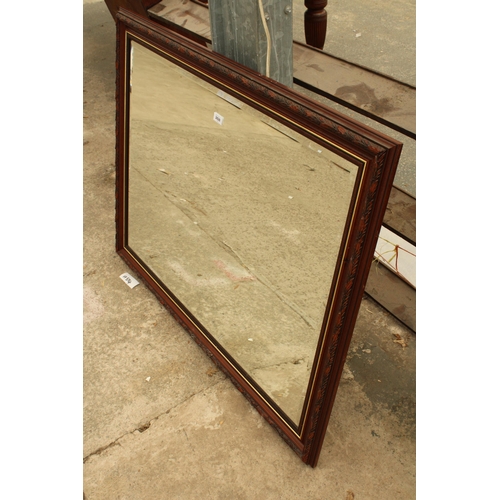 2828 - A BEVEL EDGE WALL MIRROR WITH LEAF DECORATION, 46