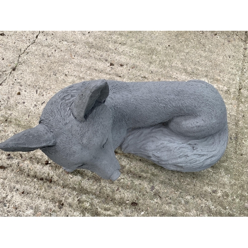 66 - ONE FOX LYING DOWN CONCRETE GARDEN ORNAMENT APPROX 38CM IN LENGTH PLUS VAT