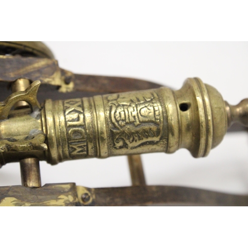 207 - A WOOD AND BRASS CANNON