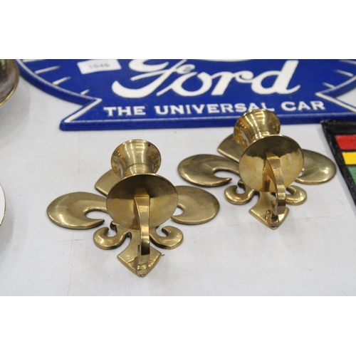 208 - A PAIR OF BRASS FLEUR DE LYS CANDLE HOLDER SCONCES