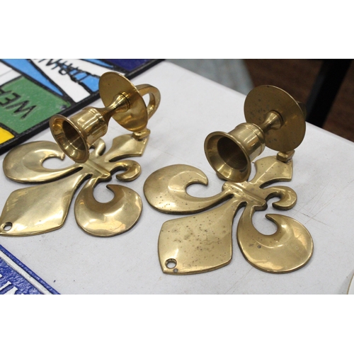 208 - A PAIR OF BRASS FLEUR DE LYS CANDLE HOLDER SCONCES